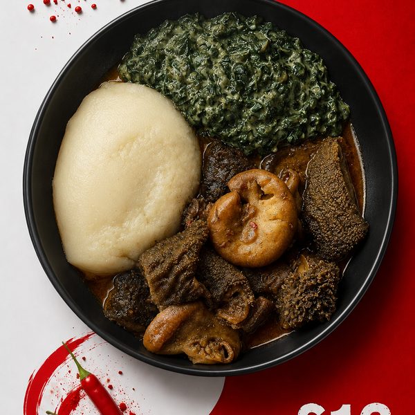 Isitshwala served with slow-cooked malusu and maguru offal stew and leafy greens